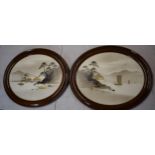 A pair of 20th century mahogany framed oriental artwork of ships sailing on water amongst