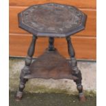 Antique carved ebonised wooden cricket table with turned legs, 60cm tall, 44cm diameter, with shaped