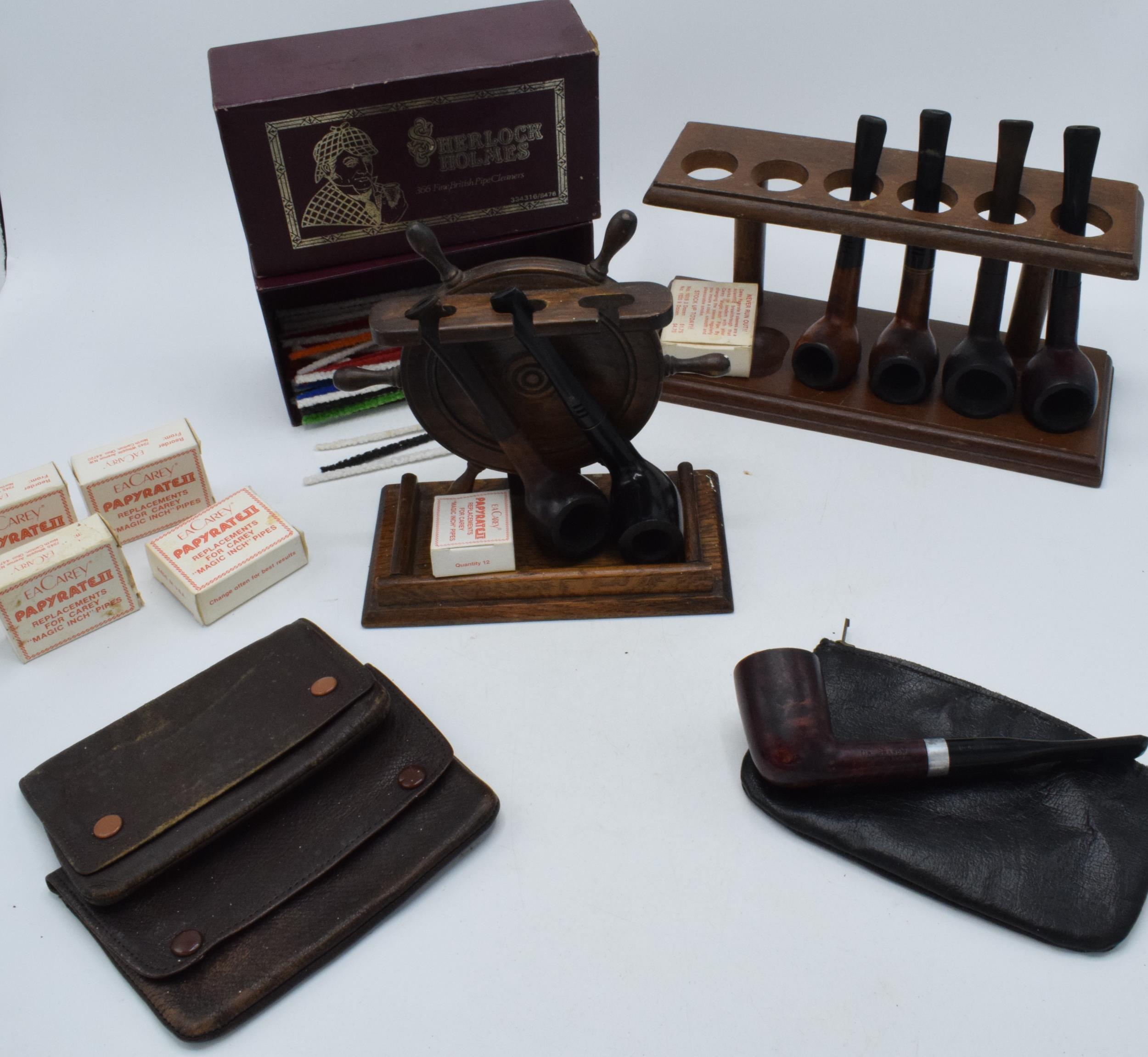 A quality of vintage smoking sundries. Including pipes, pipe racks, pouches and other items. Carey