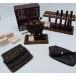 A quality of vintage smoking sundries. Including pipes, pipe racks, pouches and other items. Carey