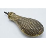 19th century brass powder flask with basket weave style decoration, 22cm long.