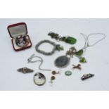 A collection of costume jewellery to include a gold on silver sweetheart brooch, together with
