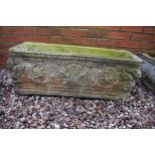 Reconstituted stone garden trough / planter with a Roman design, 76x26x29cm tall.