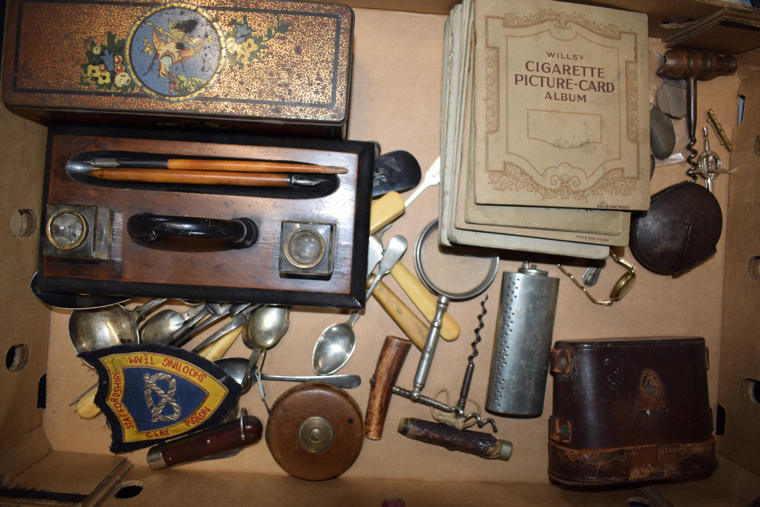 An interesting collection of items to include a desk tidy, cigarette cards in albums to include