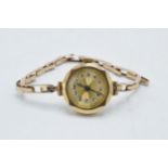 9ct gold cased ladies wristwatch on 9ct gold bracelet, gross weight 14.8 grams.