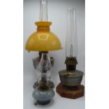 A collection of early 20th century oil lamps to include examples by Aladdin and Queen Anne. Three in