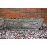 Reconstituted stone garden trough / planter with ornate design, 75x36x25cm tall.