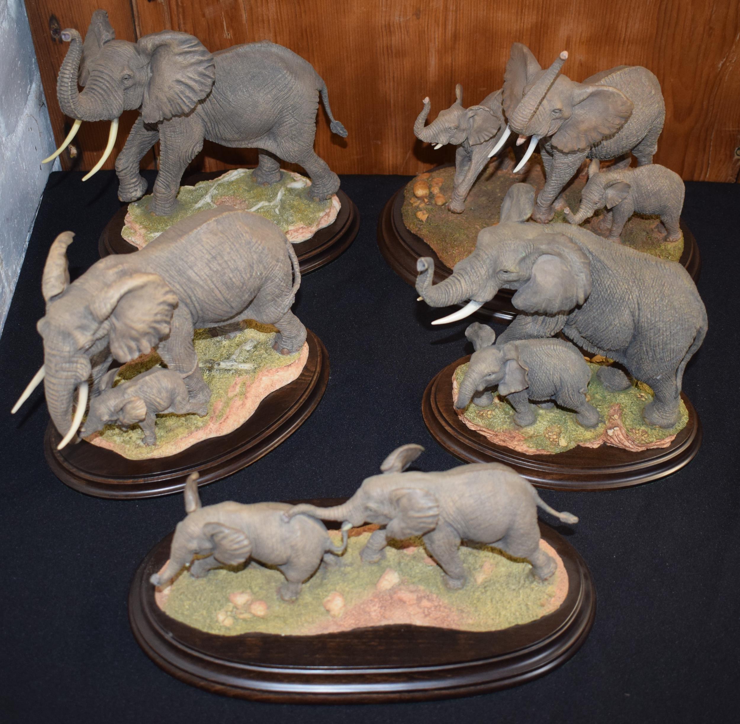 A collection of elephant figures to include Country Artists Bull Elephant CA948, Mother & Calf