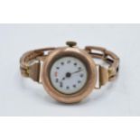 9ct gold ladies wristwatch on 9ct gold bracelet, gross weight 20.0 grams.