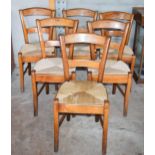 A set of 6 late 19th century elm (or similar) rush stead dining chairs, 82cm tall (6). In good