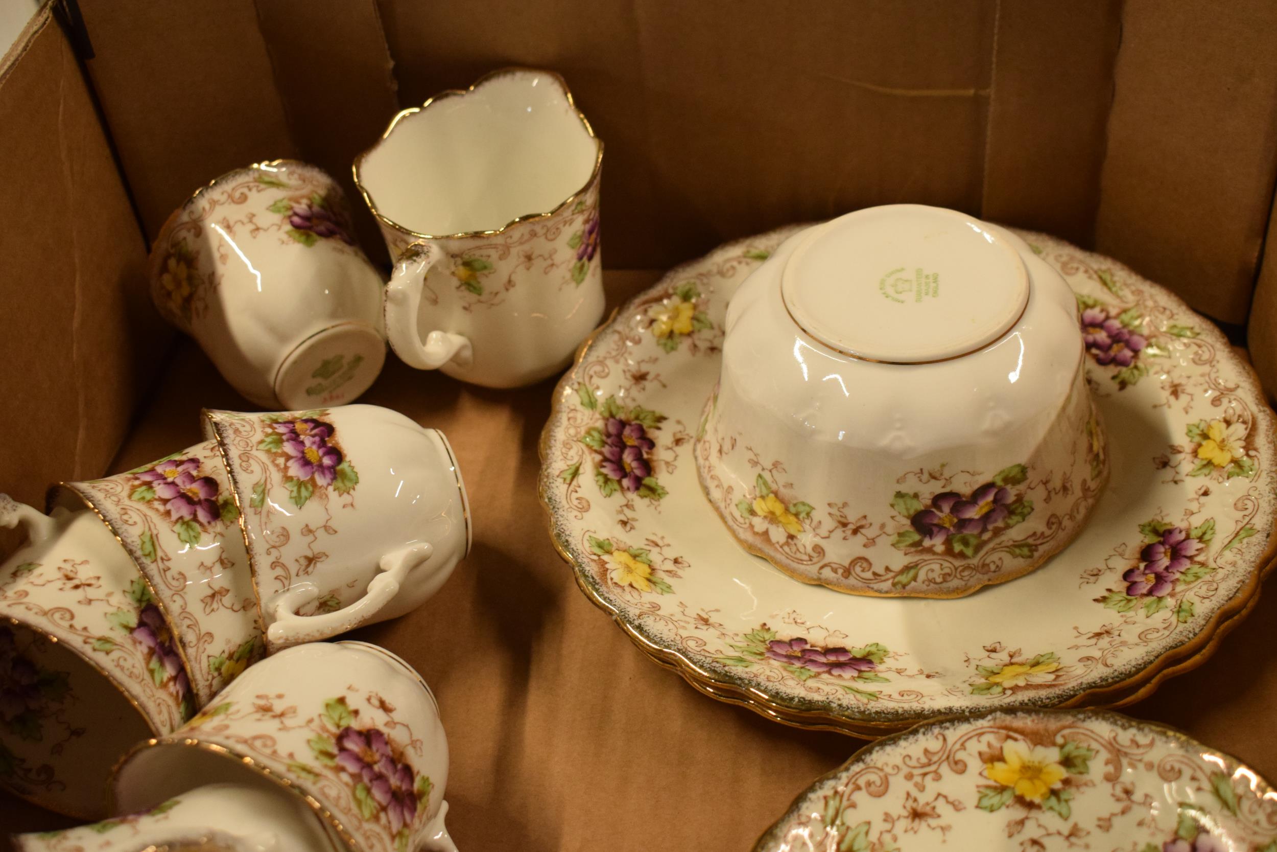 Melba China tea ware to include 9 cups, 12 saucers, 12 sides, milk and sugar with a cake plate. In - Image 2 of 6