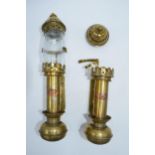 A pair of brass and copper 'GWR' candle sconces, one with glass shade, 32cm tall.