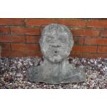 Vintage garden ornament in the form of a person's head and shoulder, 38cm tall.