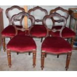 A set of 5 mahogany carved balloon back dining chairs with upholstered seats, 88cm tall (5 - 1 af).