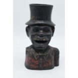 Cast metal jolly man money box with marks to ear, missing arm, 21cm tall.