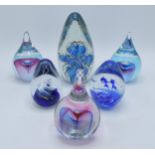 A collection of 6 heavy glass paperweights of varying forms and colours, tallest 18cm (6).