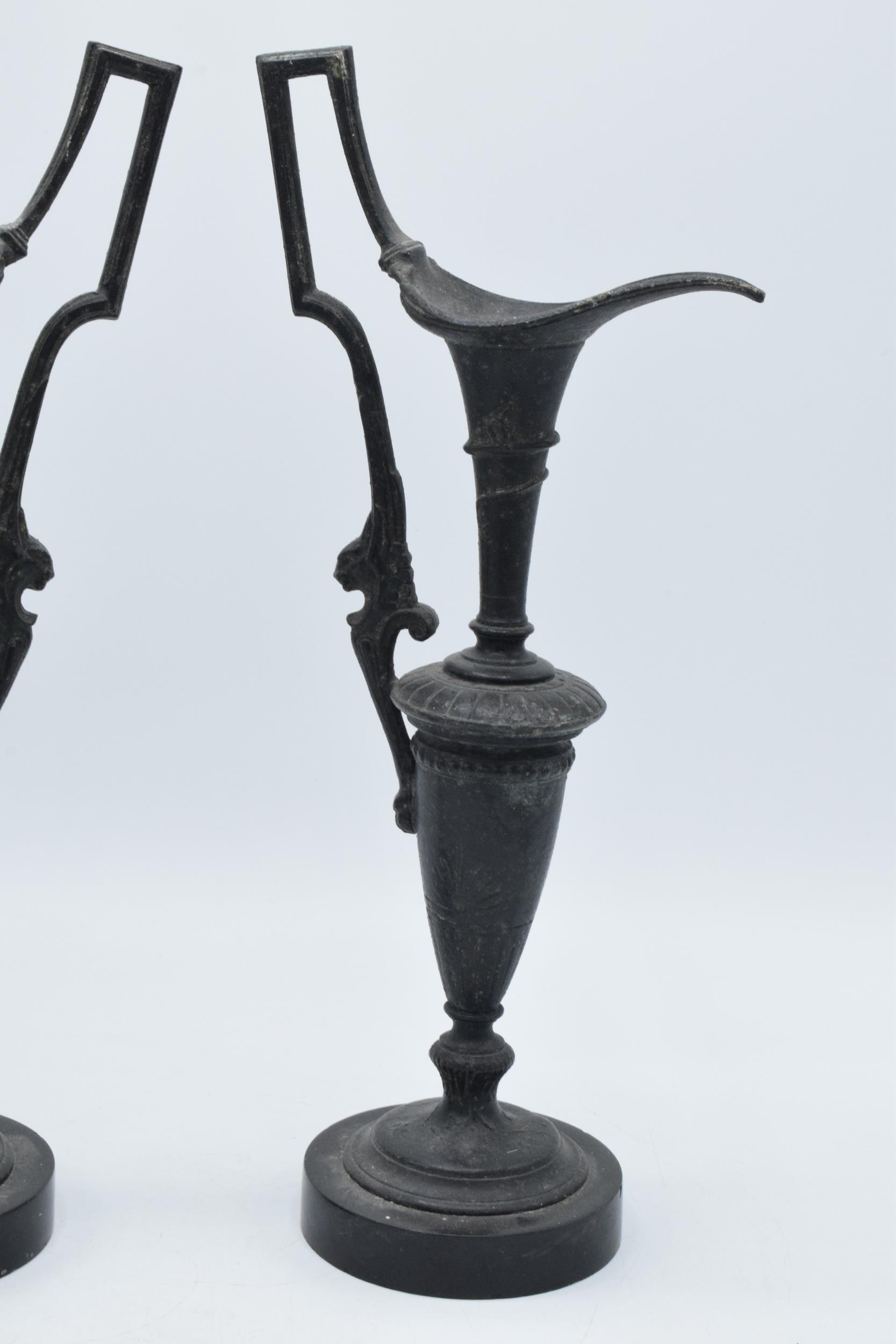 A pair of attractive spelter vases with figural handles on slate bases, damage to spout (2), 31cm - Image 2 of 5