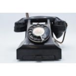 Vintage bakelite telephone and base 'Warrington', with wire. Sold as decorative.