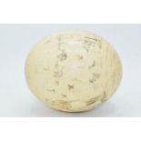 Vintage ostrich egg with overlaid decoration, 15cm long.