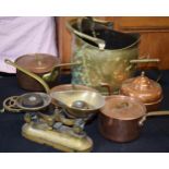A collection of metalware to include brass and copper saucepans, brass coal scuttle and similar.