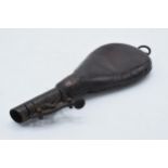 Late 19th century leather and metal powder / pellet flask, 22cm long, with pellets.