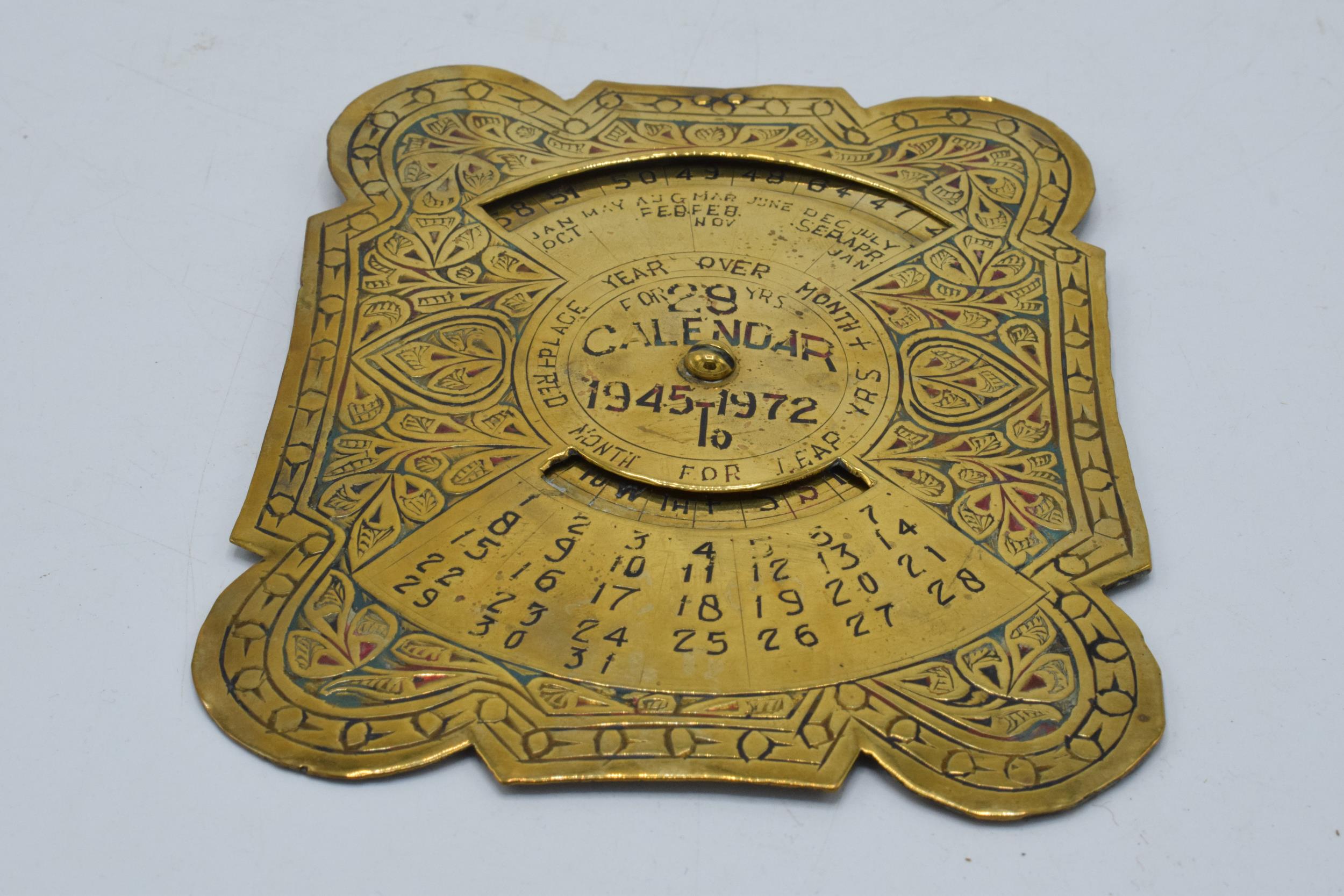 20th century brass perpetual calendar with shaped edges, 'Calendar for 29 Years 1945 to 1972',