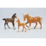 Beswick palomino stocky jogging mare together with large brown foal with palomino foal (3). In