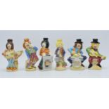 A collection of Drioli novelty decanters in the form of a jazz band to include a piano player, a