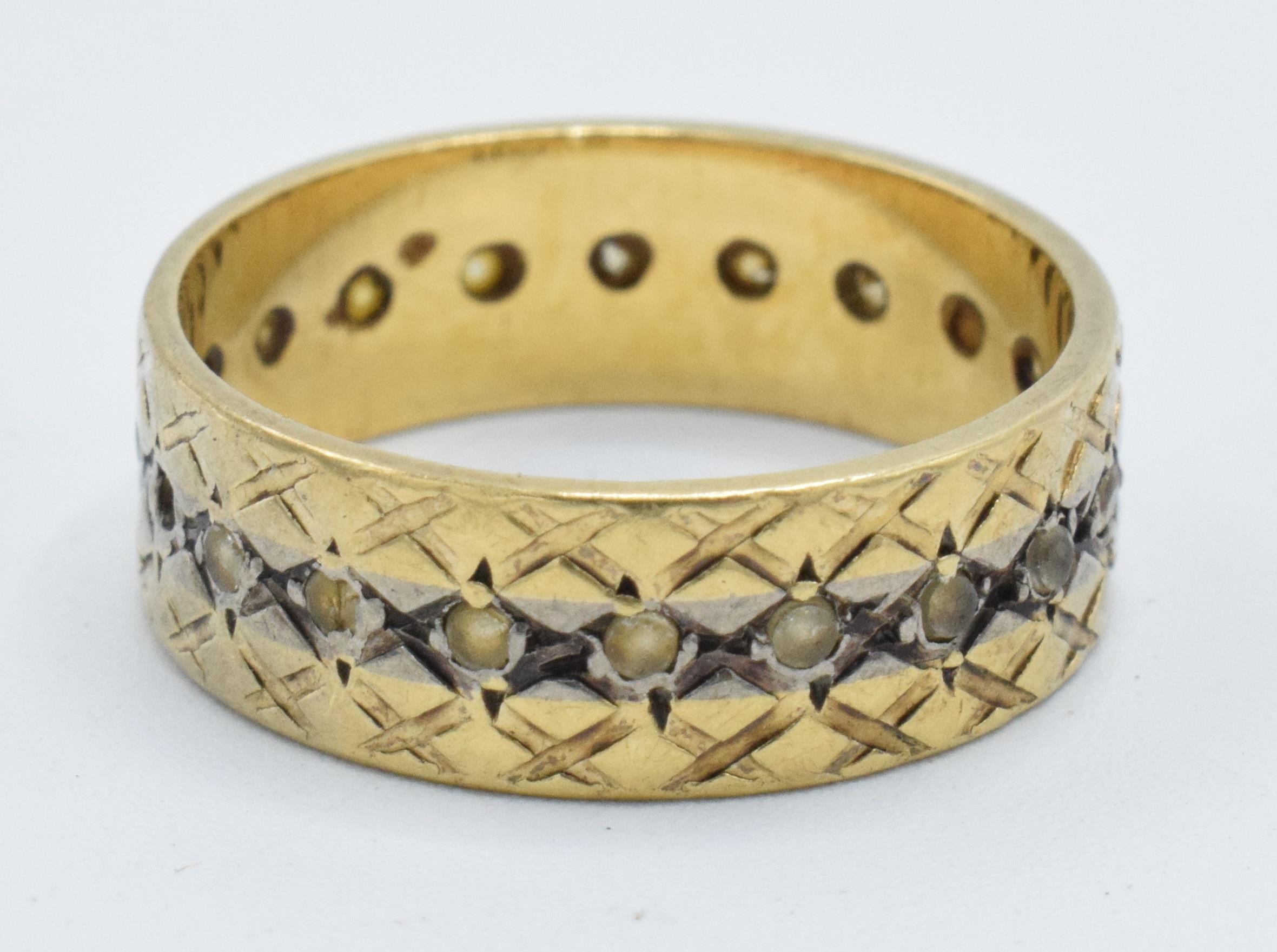 18ct gold eternity ring, 4.1 grams, size L (some stones missing).