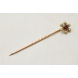 9ct gold stick pin set with amethyst and pearls, 5cm long.