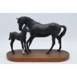 Beswick Black Beauty and Foal on wooden base. In good condition with no obvious damage or