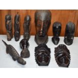 A collection of vintage 20th century African wooden carvings to include a large carved bust, 24cm
