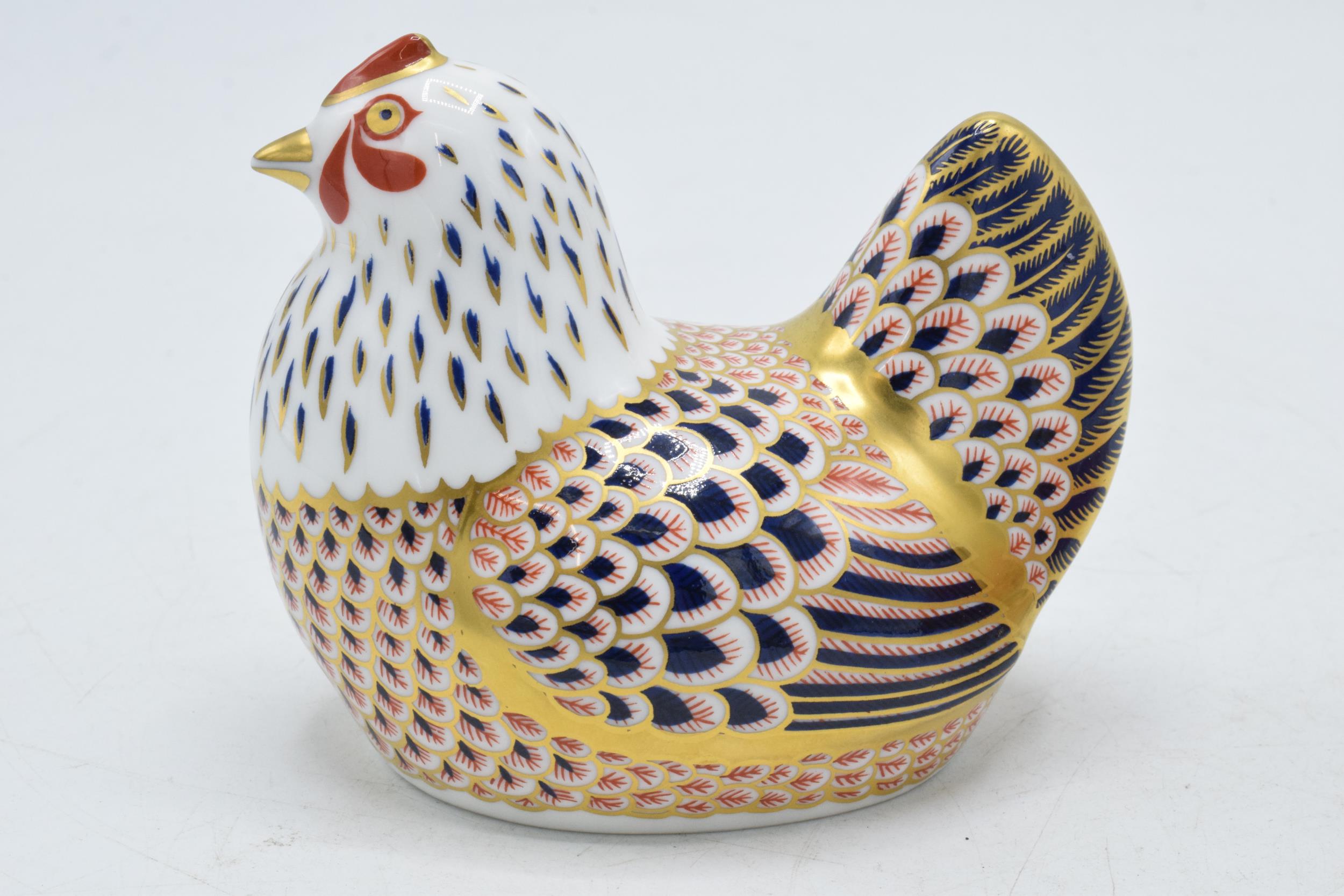 Royal Crown Derby paperweight of a hen with gold stopper, red printed marks. In good condition