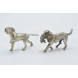 A pair of silver miniature figures of a game spaniel and a similar dog, combined weight 78 grams (