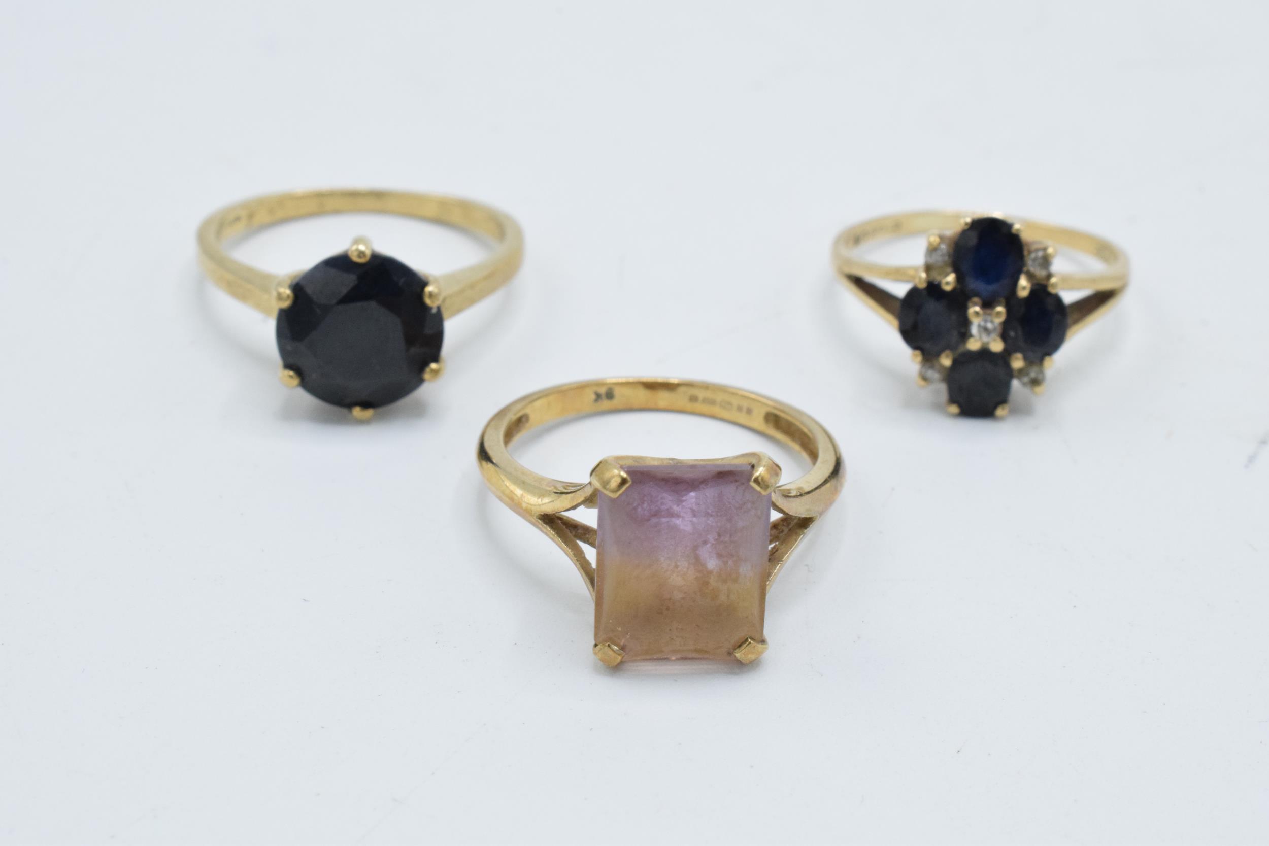 A trio of 9ct gold dress rings set with semi precious stones, 8.2 grams (3).