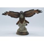 Capo Di Monte realistic model of an Eagle / Bird of Prey landing on a rocky surface, 34cm wide. In