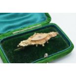 9ct gold bar brooch set with diamond chip, 3.9 grams, in box.