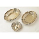 A pair of silver pierced decoration sweet dishes, Chester 1931 and a heart shaped pin dish, 95.6