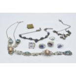 A collection of silver and white coloured metal jewellery to include necklaces, rings and others,