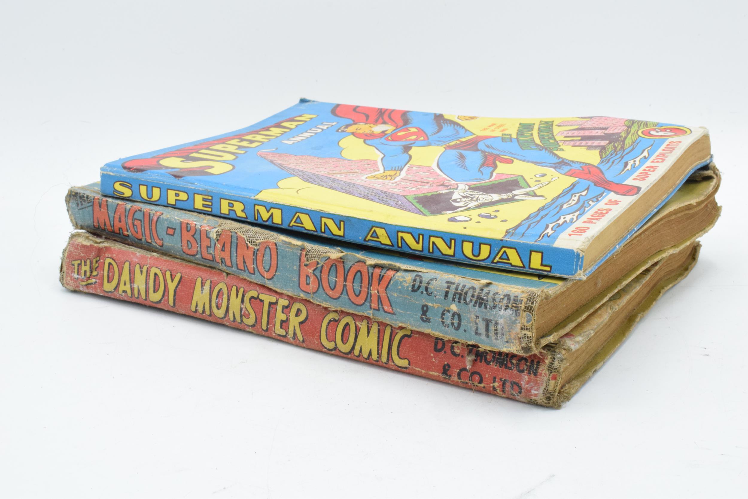 'The Dandy Monster Comic 1943', together with 'The Magic Beano Book' and 'Superman Annual 1958-9' (