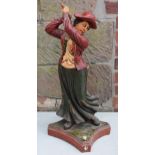 Mid century composite figure of a lady golfing, 71cm tall.