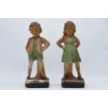 A pair of 1930s plaster Art Deco figures, with registration numbers to the reverse, 31cm tall (2).