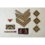 A good collections of WWII era military woven cloth badges to include a facing pair of 7th Army