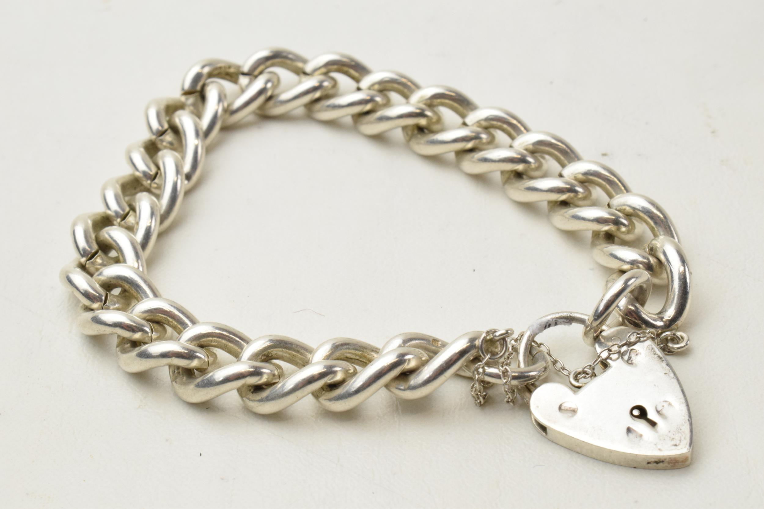 Heavy silver curb bracelet with padlock, Birmingham 1975, 59.2 grams.