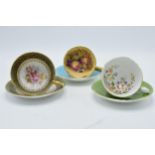 Aynsley cups and saucers to include an Orchard Gold on blue, signed D James, another with a pink