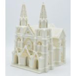 Large pottery model of a cathedral in creamware, in the style of Crested China / Belleek, 25cm tall.