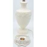 Wedgwood cream ware lamp base together with a Carlton China model of The British Stadium, Wembley (