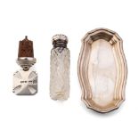 A trio of silver items to include a silver shaped dish, 10cm long, 23.8 grams, a silver topped cut