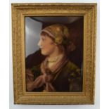 A convex glass crystoleum, portrait of a young woman facing left, in period gilt frame, 30x25cm.