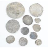 An interesting collection of hammered silver coins of varying sizes and denominations to include